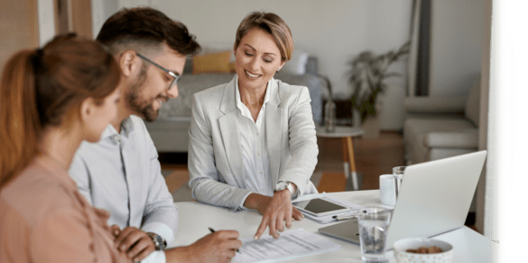couple sitting down with mortgage officer