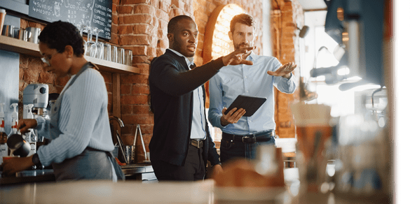 Two business owners talking in their restaurant
