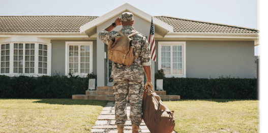 Man in uniform standing outside of home.