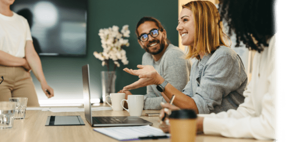 group of coworkers chatting and smiling