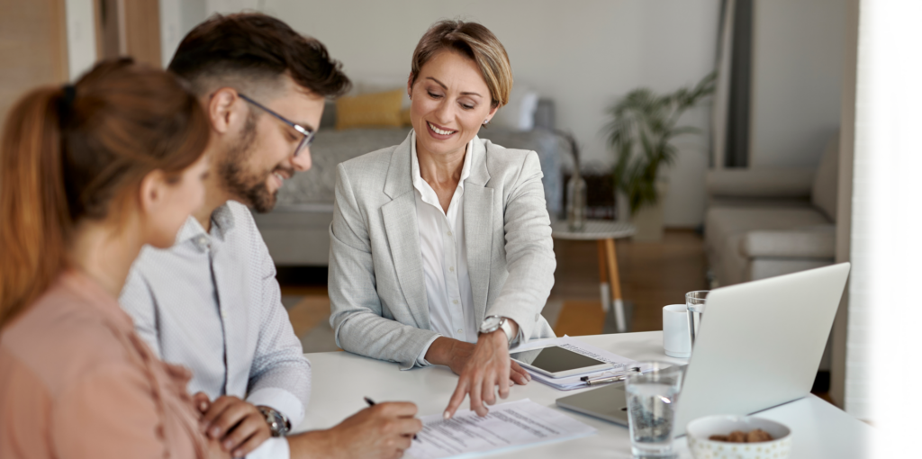 couple sitting down with mortgage officer