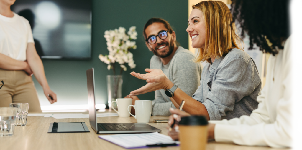 group of coworkers chatting and smiling
